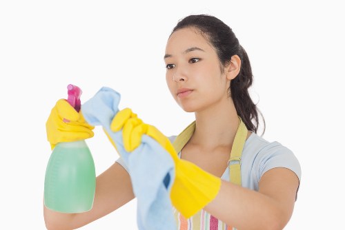 Professional carpet cleaners in Sutton working on a living room carpet