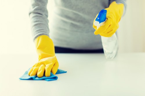 Commercial cleaning team working in a Sutton office reception area
